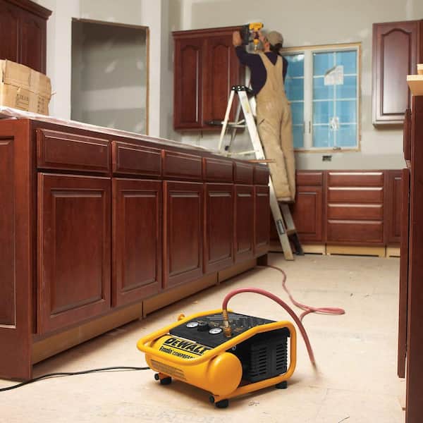 1 Gal. 135 PSI Portable Electric Trim Air Compressor, 18-Gauge Pneumatic Brad Nailer and 50 ft. x 1/4 in. Air Hose